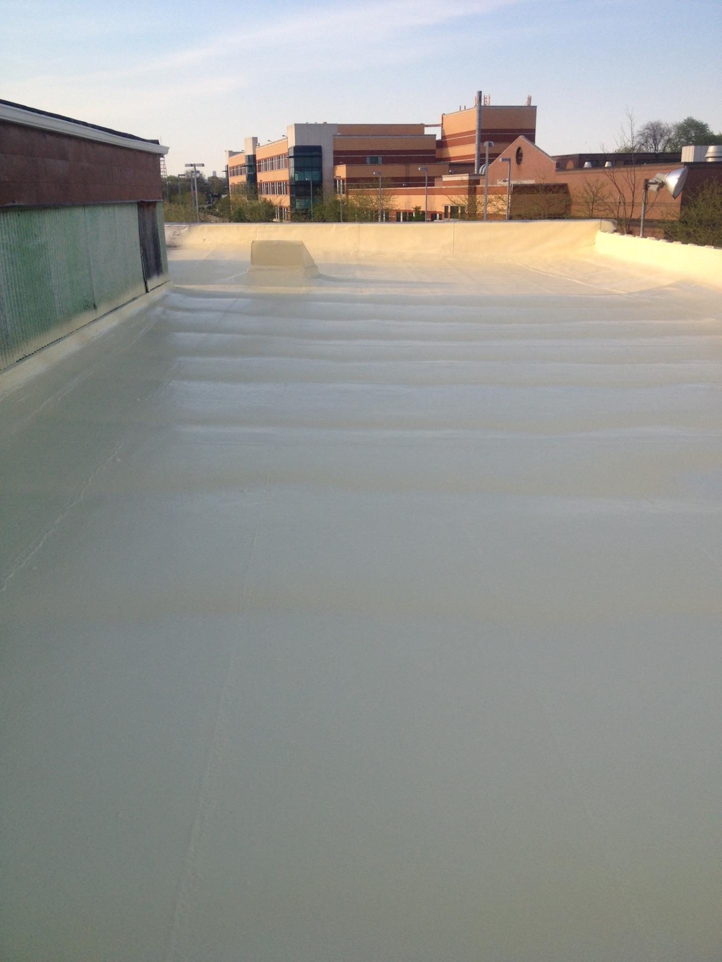 Home with recoated shingle roof in fresh color